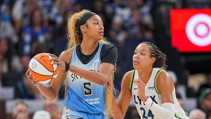 Jul 22, 2025; Minneapolis, Minnesota, USA; Minnesota Lynx forward Napheesa Collier (24) defends Chicago Sky forward Angel Reese (5) in the fourth quarter at Target Center. Mandatory Credit: Brad Rempel-Imagn Images