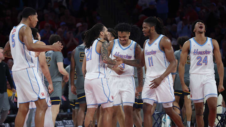 Jan 13, 2026; Houston, Texas, USA; Houston Cougars forward Chase McCarty (24) and teammates react to Houston Cougars guard Kingston Flemings (4) play against the West Virginia Mountaineers in the second half  at Fertitta Center. Mandatory Credit: Thomas Shea-Imagn Images