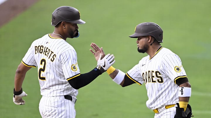 May 14, 2025; San Diego, California, USA; San Diego Padres shortstop Xander Bogaerts (2) is congratulated by Luis Arraez (4) after hitting three-run home run during the first inning against the Los Angeles Angels at Petco Park. Mandatory Credit: Denis Poroy-Imagn Images