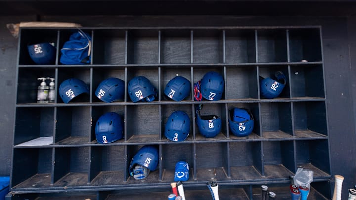 Mar 19, 2022; Peoria, Arizona, USA; A general view of hats and bats belonging the the Los Angeles Dodgers before spring training game against the Seattle Mariners at Peoria Sports Complex. Mandatory Credit: Allan Henry-Imagn Images Mar 19, 2022; Peoria, Arizona, USA; A general view of hats and bats belonging the the Los Angeles Dodgers before spring training game against the Seattle Mariners at Peoria Sports Complex. Mandatory Credit: Allan Henry-Imagn Images