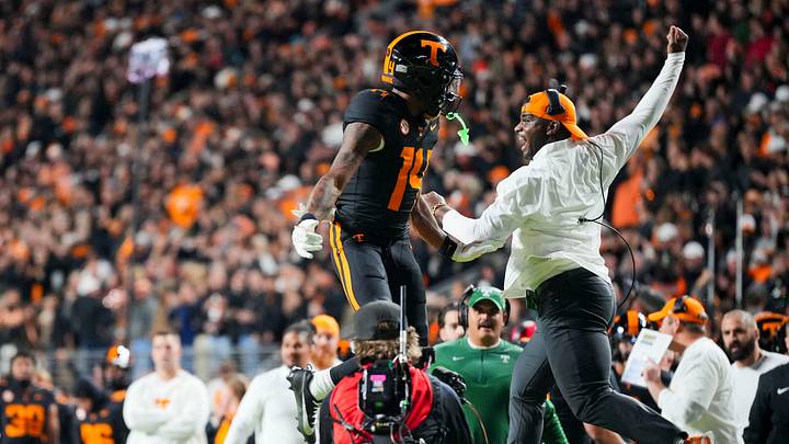 Tennessee wide receivers coach Kelsey Pope and wide receiver Braylon Staley (14) with the leaping celebration after Braylon’s touchdown reception during an NCAA college football game against Oklahoma on November 1, 2025, in Knoxville, Tenn. Tennessee wide receivers coach Kelsey Pope and wide receiver Braylon Staley (14) with the leaping celebration after Braylon’s touchdown reception during an NCAA college football game against Oklahoma on November 1, 2025, in Knoxville, Tenn.
