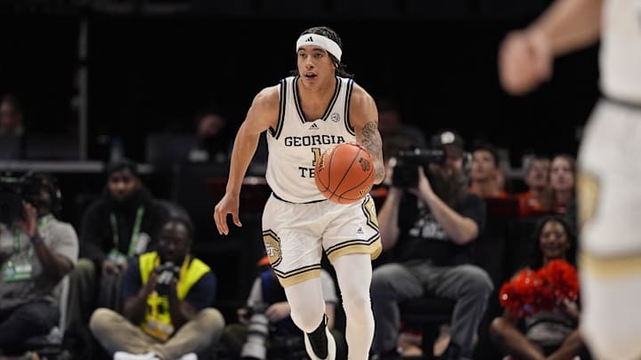 Mar 12, 2025; Charlotte, NC, USA; Georgia Tech Yellow Jackets guard Naithan George (1) brings the ball up court against the Virginia Cavaliers during the second half at Spectrum Center. Mandatory Credit: Jim Dedmon-Imagn Images