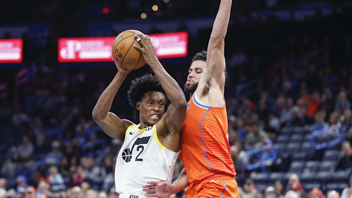 Dec 3, 2024; Oklahoma City, Oklahoma, USA; Utah Jazz guard Collin Sexton (2) drives to the basket beside Oklahoma City Thunder guard Ajay Mitchell (25) during the second half of an NBA Cup game at Paycom Center. Mandatory Credit: Alonzo Adams-Imagn Images