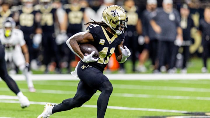 Nov 10, 2024; New Orleans, Louisiana, USA;   New Orleans Saints running back Alvin Kamara (41) rushes against the Atlanta Falcons during the first half at Caesars Superdome. Mandatory Credit: Stephen Lew-Imagn Images