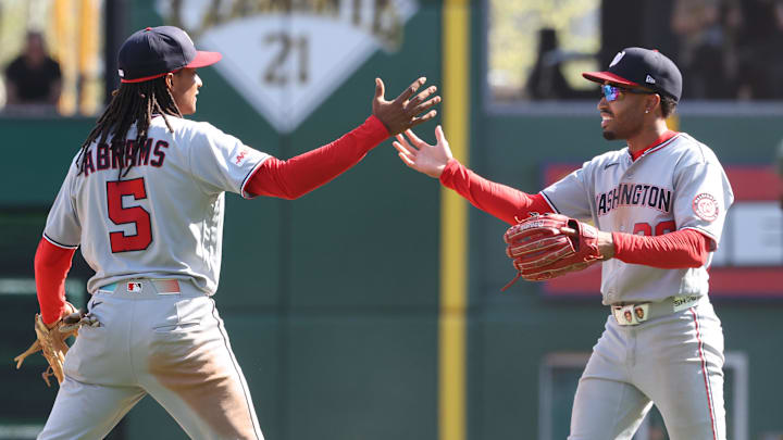 Apr 16, 2026; Pittsburgh, Pennsylvania, USA;  Washington Nationals shortstop CJ Abrams (5) and second baseman  Nasim Nuñez (right) celebrate after defeating the Pittsburgh Pirates I ten innings at PNC Park. Mandatory Credit: Charles LeClaire-Imagn Images