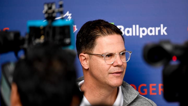 Toronto Blue Jays general manager Ross Atkins (glasses) is interviewed during spring training at Spectrum Field in 2020. Toronto Blue Jays general manager Ross Atkins (glasses) is interviewed during spring training at Spectrum Field in 2020.