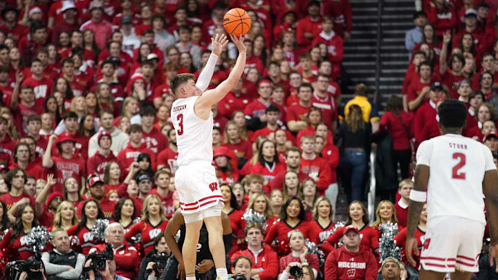 Jan 26, 2024; Madison, Wisconsin, USA; Wisconsin Badgers guard Connor Essegian (3) scores a three