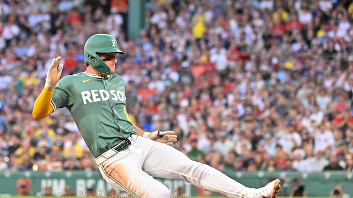 Aug 1, 2025; Boston, Massachusetts, USA; Boston Red Sox left fielder Roman Anthony (19) slides into third base during the third inning against the Houston Astros at Fenway Park. Mandatory Credit: Eric Canha-Imagn Images