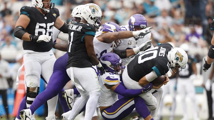 Nov 10, 2024; Jacksonville, Florida, USA; Minnesota Vikings linebacker Ivan Pace Jr. (0) sacks Jacksonville Jaguars quarterback Mac Jones (10) during the second quarter at EverBank Stadium. Mandatory Credit: Morgan Tencza-Imagn Images