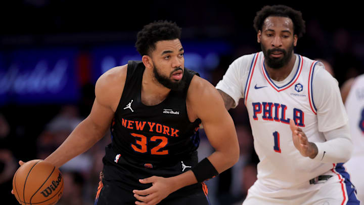 Dec 19, 2025; New York, New York, USA; New York Knicks center Karl-Anthony Towns (32) controls the ball against Philadelphia 76ers center Andre Drummond (1) during the third quarter at Madison Square Garden. Mandatory Credit: Brad Penner-Imagn Images