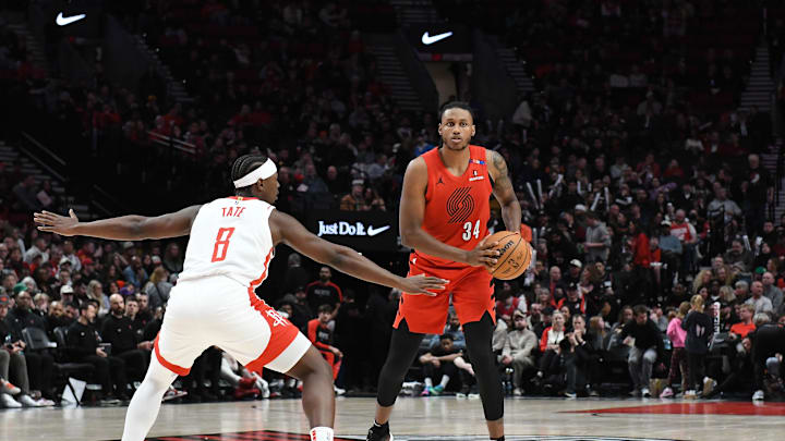 Jan 18, 2025; Portland, Oregon, USA;  Portland Trail Blazers forward Jabari Walker (34) looks to pass the ball against Houston Rockets forward Jae'Sean Tate (8) during the second half at Moda Center. Mandatory Credit: Brian Murphy-Imagn Images