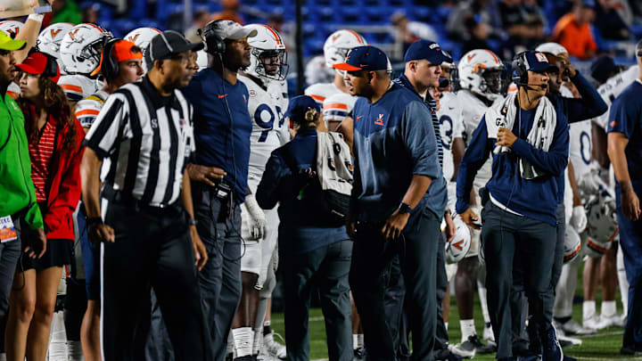 Oct 1, 2022; Durham, North Carolina, USA; Virginia Cavaliers head coach Tony Elliot talks with running back coach Keith Gaither during the second half against the Duke Blue Devils at Wallace Wade Stadium. Mandatory Credit: Jaylynn Nash-Imagn Images