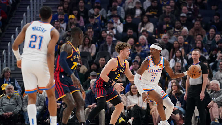 Jan 29, 2025; San Francisco, California, USA; Oklahoma City Thunder guard Shai Gilgeous-Alexander (2) dribbles the ball next to Golden State Warriors guard Brandin Podziemski (2) in the first quarter at the Chase Center. Mandatory Credit: Cary Edmondson-Imagn Images Jan 29, 2025; San Francisco, California, USA; Oklahoma City Thunder guard Shai Gilgeous-Alexander (2) dribbles the ball next to Golden State Warriors guard Brandin Podziemski (2) in the first quarter at the Chase Center. Mandatory Credit: Cary Edmondson-Imagn Images