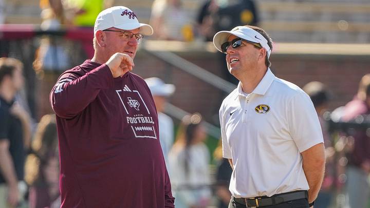 Oct 10, 2026; Columbia, Missouri, USA; Texas A&M Aggies head coach Mike Elko talks with Missouri Tigers head coach Eli Drinkwitz prior to a game at Faurot Field at Memorial Stadium. Mandatory Credit: Denny Medley-Imagn Images Oct 10, 2026; Columbia, Missouri, USA; Texas A&M Aggies head coach Mike Elko talks with Missouri Tigers head coach Eli Drinkwitz prior to a game at Faurot Field at Memorial Stadium. Mandatory Credit: Denny Medley-Imagn Images