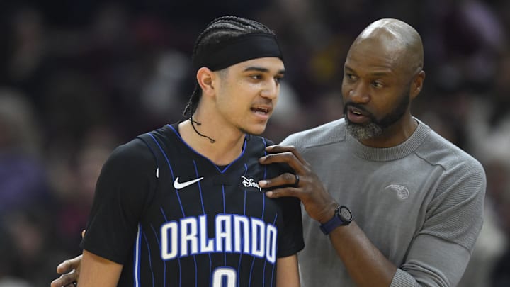 Feb 22, 2024; Cleveland, Ohio, USA; Orlando Magic head coach Jamahl Mosley talks with guard Anthony Black (0) in the second quarter against the Cleveland Cavaliers at Rocket Mortgage FieldHouse. Mandatory Credit: David Richard-USA TODAY Sports