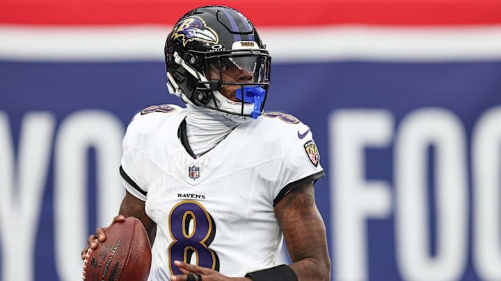 Dec 15, 2024; East Rutherford, New Jersey, USA; Baltimore Ravens quarterback Lamar Jackson (8) drops back to pass during the second half against the New York Giants at MetLife Stadium. Mandatory Credit: Vincent Carchietta-Imagn Images