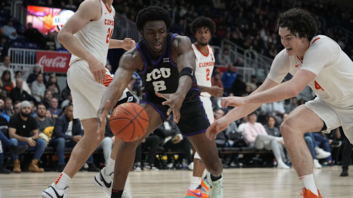 Dec 9, 2023; Toronto, Ontario, CAN; TCU Horned Frogs center Ernest Udeh Jr. (8) reaches for a ball against the Clemson Tigers