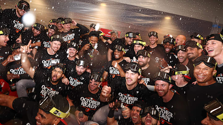 Sep 24, 2024; Bronx, New York, USA; The Baltimore Orioles celebrate in the locker room after defeating the New York Yankees to clinched an AL playoff berth at Yankee Stadium. 