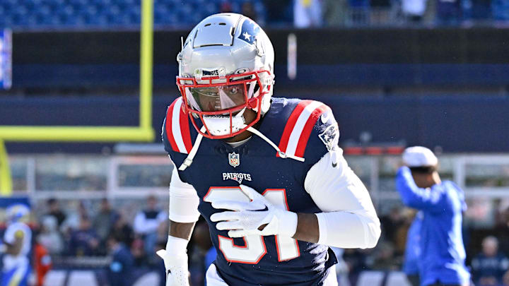 Nov 17, 2024; Foxborough, Massachusetts, USA; New England Patriots cornerback Jonathan Jones (31) warms up before a game against the Los Angeles Rams at Gillette Stadium. Mandatory Credit: Eric Canha-Imagn Images