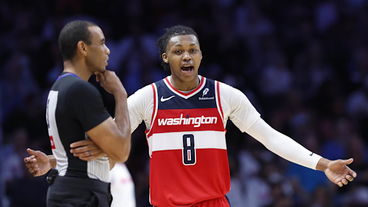 Apr 13, 2025; Miami, Florida, USA; Washington Wizards guard Bub Carrington (8) argues with an official against the Miami Heat during the second half at Kaseya Center. Mandatory Credit: Rhona Wise-Imagn Images