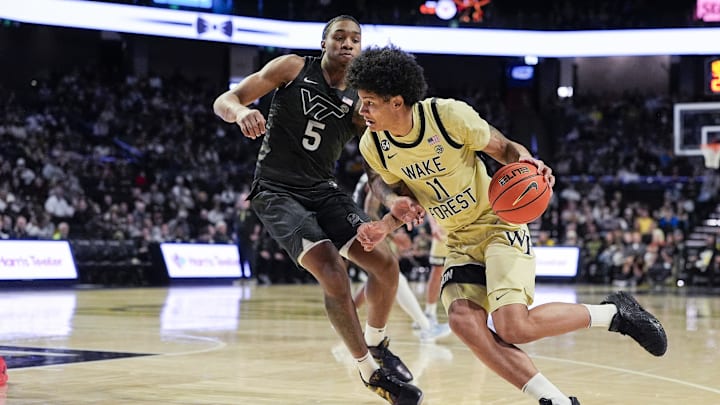 Jan 3, 2026; Winston-Salem, N.C.; Wake Forest forward Marqus Marion (11) drives to the basket against Virginia Tech forward Sin'Cere Jones (5).