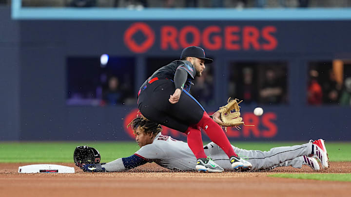 May 2, 2025; Toronto, Ontario, CAN; Cleveland Guardians third baseman José Ramírez (11) is safe at second base ahead of the tag from Toronto Blue Jays shortstop Bo Bichette (11) at Rogers Centre. Mandatory Credit: Nick Turchiaro-Imagn Images