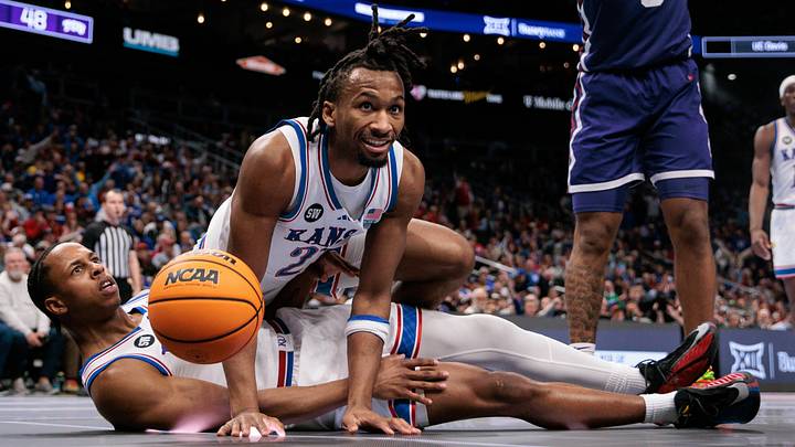 Mar 12, 2026; Kansas City, MO, USA; Kansas basketball guard Elmarko Jackson (13) and guard Darryn Peterson (22) get tangled up during the second half against the TCU Horned Frogs at T-Mobile Center. Mandatory Credit: William Purnell-Imagn Images Mar 12, 2026; Kansas City, MO, USA; Kansas basketball guard Elmarko Jackson (13) and guard Darryn Peterson (22) get tangled up during the second half against the TCU Horned Frogs at T-Mobile Center. Mandatory Credit: William Purnell-Imagn Images