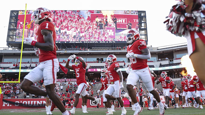 Houston Cougars players run onto the field before the game against the Stephen F. Austin Lumberjacks at TDECU Stadium. Houston Cougars players run onto the field before the game against the Stephen F. Austin Lumberjacks at TDECU Stadium.