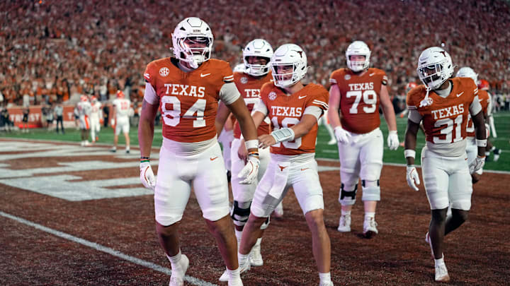 Texas Longhorns tight end Jordan Washington and teammates react after Washington scored a touchdown during the first half against the Sam Houston Bearkats at Darrell K Royal-Texas Memorial Stadium. 