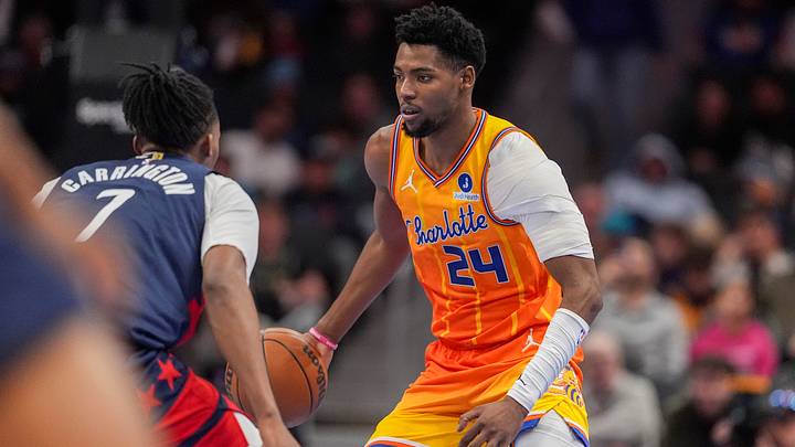 Charlotte Hornets forward Brandon Miller (24) handles the ball against Washington Wizards guard Bub Carrington Charlotte Hornets forward Brandon Miller (24) handles the ball against Washington Wizards guard Bub Carrington
