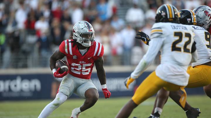 Oct 17, 2026; Oxford, Mississippi, USA;  Mississippi Rebels running back Makhi Frazier (25) carries the ball as Missouri Tigers safety Elijah Dotson (22) and linebacker Dante McClellan (9) pursues during the second half at Vaught-Hemingway Stadium.  Mandatory Credit: Petre Thomas-Imagn Images