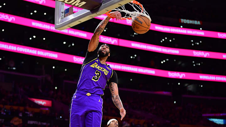 Nov 19, 2024; Los Angeles, California, USA;  Los Angeles Lakers forward Anthony Davis (3) scores a basket against the against the Utah Jazz during the first half at Crypto.com Arena. Mandatory Credit: Gary A. Vasquez-Imagn Images