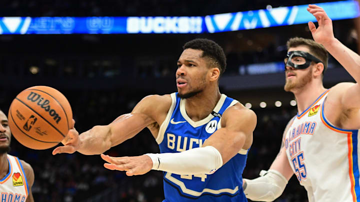 Mar 16, 2025; Milwaukee, Wisconsin, USA; Milwaukee Bucks forward Giannis Antetokounmpo (34) passes the ball away from Oklahoma City Thunder center Isaiah Hartenstein (55) in the fourth quarter at Fiserv Forum. Mandatory Credit: Benny Sieu-Imagn Images