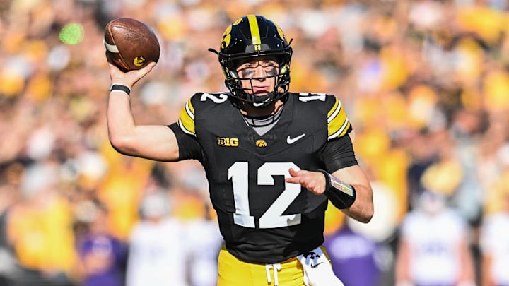 Oct 26, 2024; Iowa City, Iowa, USA; Iowa Hawkeyes quarterback Cade McNamara throws a pass against the Northwestern Wildcats during the first quarter at Kinnick Stadium.