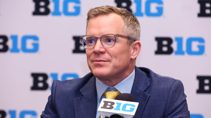 Oct 3, 2024; Rosemont, IL, USA; Michigan head coach Dusty May takes a question at the podium during the 2024 Big Ten Menís Basketball media day at Donald E. Stephens Convention Center. Mandatory Credit: Melissa Tamez-Imagn Images
