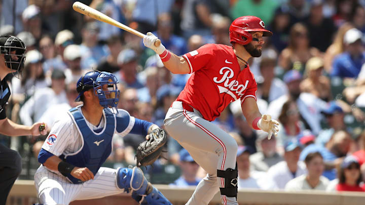 May 31, 2024; Chicago, Illinois, USA; Cincinnati Reds designated hitter Nick Martini (23) hits an RBI single during the fourth inning against the Chicago Cubs at Wrigley Field. Mandatory Credit: Melissa Tamez-Imagn Images May 31, 2024; Chicago, Illinois, USA; Cincinnati Reds designated hitter Nick Martini (23) hits an RBI single during the fourth inning against the Chicago Cubs at Wrigley Field. Mandatory Credit: Melissa Tamez-Imagn Images
