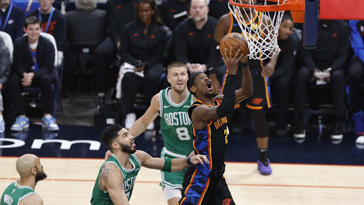 Jan 5, 2025; Oklahoma City, Oklahoma, USA; Oklahoma City Thunder guard Shai Gilgeous-Alexander (2) shoots the ball defended by Boston Celtics forward Jayson Tatum (0) during the first quarter at Paycom Center. Mandatory Credit: Alonzo Adams-Imagn Images Jan 5, 2025; Oklahoma City, Oklahoma, USA; Oklahoma City Thunder guard Shai Gilgeous-Alexander (2) shoots the ball defended by Boston Celtics forward Jayson Tatum (0) during the first quarter at Paycom Center. Mandatory Credit: Alonzo Adams-Imagn Images