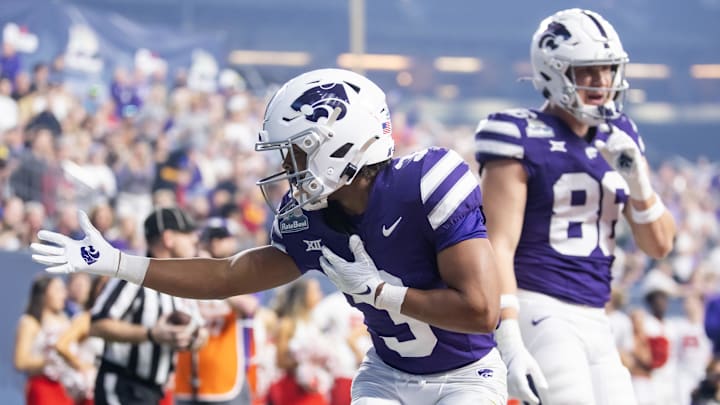 Dec 26, 2024; Phoenix, AZ, USA; Kansas State Wildcats running back Dylan Edwards (3) celebrates a touchdown against the Rutgers Scarlet Knights during the Rate Bowl at Chase Field. Mandatory Credit: Mark J. Rebilas-Imagn Images