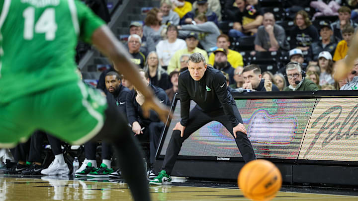 Jan 29, 2025; Wichita, Kansas, USA; North Texas Mean Green coach Ross Hodge watches game play during the first half against the Wichita State Shockers at Charles Koch Arena. Mandatory Credit: William Purnell-Imagn Images