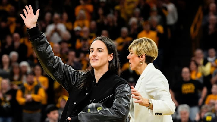 Caitlin Clark waves to the fans during her jersey retirement ceremony Sunday, Feb. 2, 2025 at Carver-Hawkeye Arena in Iowa City, Iowa. Caitlin Clark waves to the fans during her jersey retirement ceremony Sunday, Feb. 2, 2025 at Carver-Hawkeye Arena in Iowa City, Iowa.