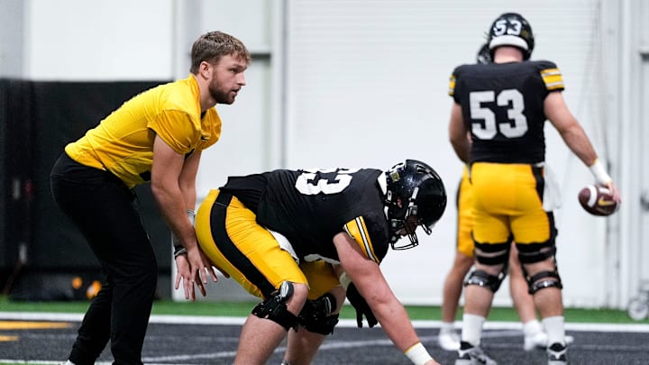 Iowa quarterback Mark Gronowski (11) lines up under center during a drill at practice Thursday, April 3, 2025 in Iowa City, Iowa. Iowa quarterback Mark Gronowski (11) lines up under center during a drill at practice Thursday, April 3, 2025 in Iowa City, Iowa.