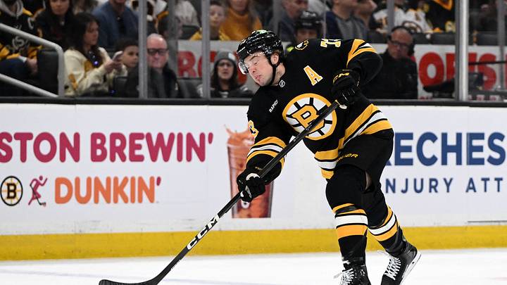 Apr 11, 2026; Boston, Massachusetts, USA; Boston Bruins defenseman Charlie McAvoy (73) attempts a shot against the Tampa Bay Lightning during the first period at the TD Garden. Mandatory Credit: Brian Fluharty-Imagn Images