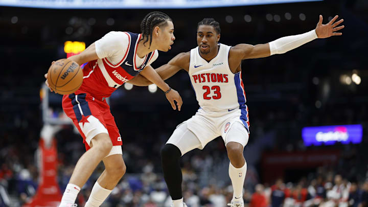 Nov 17, 2024; Washington, District of Columbia, USA; Washington Wizards forward Kyshawn George (18) dribbles the ball as Detroit Pistons guard Jaden Ivey (23) defends in the second half at Capital One Arena. Mandatory Credit: Geoff Burke-Imagn Images