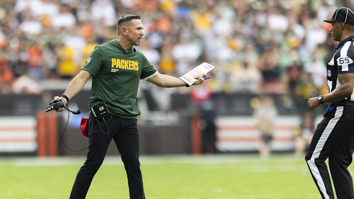 Sep 21, 2025; Cleveland, Ohio, USA; Green Bay Packers head coach Matt LaFleur argues a call with line judge Walt Coleman IV (65) during the fourth quarter at Huntington Bank Field. Mandatory Credit: Scott Galvin-Imagn Images