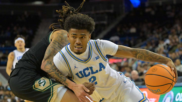 Nov 18, 2025; Los Angeles, California, USA;  UCLA Bruins guard Donovan Dent (2) is defended by Sacramento State Hornets guard Jahni Summers (4) during the second half at Pauley Pavilion presented by Wescom Financial. Mandatory Credit: Jayne Kamin-Oncea-Imagn Images