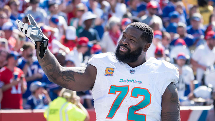 Miami Dolphins offensive tackle Terron Armstead (72) reacts to the crowd before a game against the Buffalo Bills at Highmark Stadium in 2023.