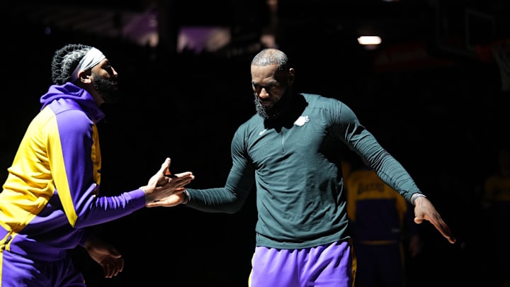 Dec 19, 2024; Sacramento, California, USA; Los Angeles Lakers forward LeBron James (23) meets with forward Anthony Davis (3) before the start of the game against the Sacramento Kings at the Golden 1 Center. Mandatory Credit: Cary Edmondson-Imagn Images