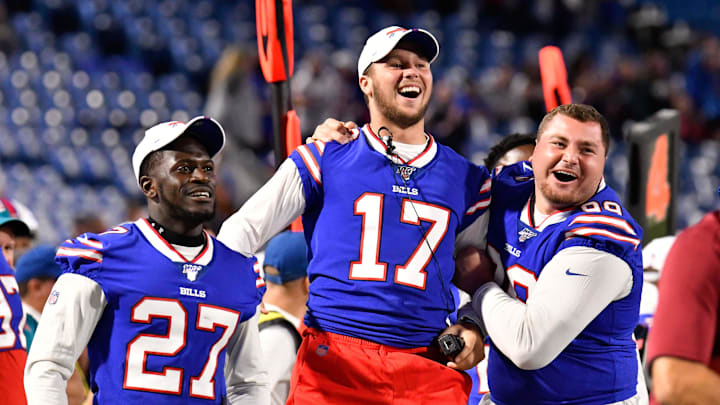 Bills quarterback Josh Allen, cornerback Tre'Davious White and defensive tackle Harrison Phillips react to a TD in 2019