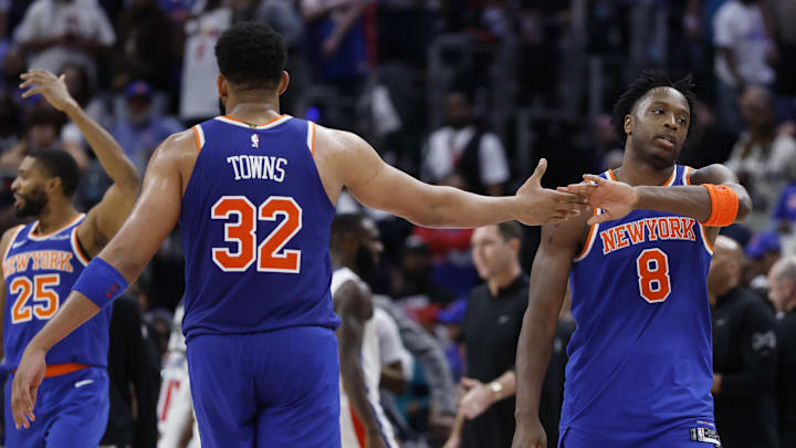 Apr 24, 2025; Detroit, Michigan, USA; New York Knicks center Karl-Anthony Towns (32) and forward OG Anunoby (8) celebrates in the second half against the Detroit Pistons during game three of first round for the 2024 NBA Playoffs at Little Caesars Arena. Mandatory Credit: Rick Osentoski-Imagn Images