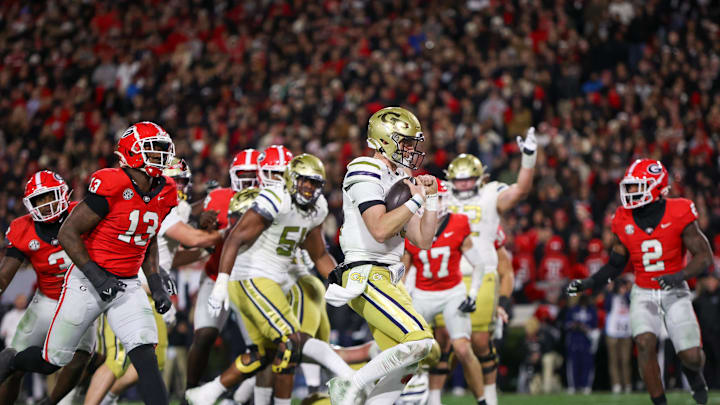 Nov 29, 2024; Athens, Georgia, USA; Georgia Tech Yellow Jackets quarterback Haynes King (10) runs for a touchdown against the Georgia Bulldogs in the second quarter at Sanford Stadium. Mandatory Credit: Brett Davis-Imagn Images Nov 29, 2024; Athens, Georgia, USA; Georgia Tech Yellow Jackets quarterback Haynes King (10) runs for a touchdown against the Georgia Bulldogs in the second quarter at Sanford Stadium. Mandatory Credit: Brett Davis-Imagn Images